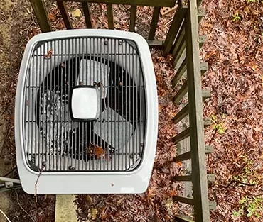 AC Air Conditioner home outdoor unit overhead during Fall time with some morning frost